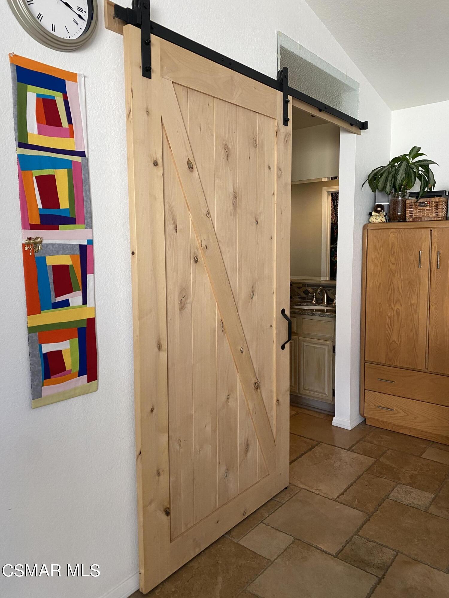 801 Congressional Road Simi Valley, CA 93065 - Photo 8 of 22 a room with painting on the wall and a shower