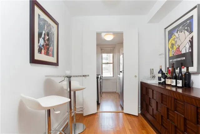 a bathroom with a sink mirror and vanity