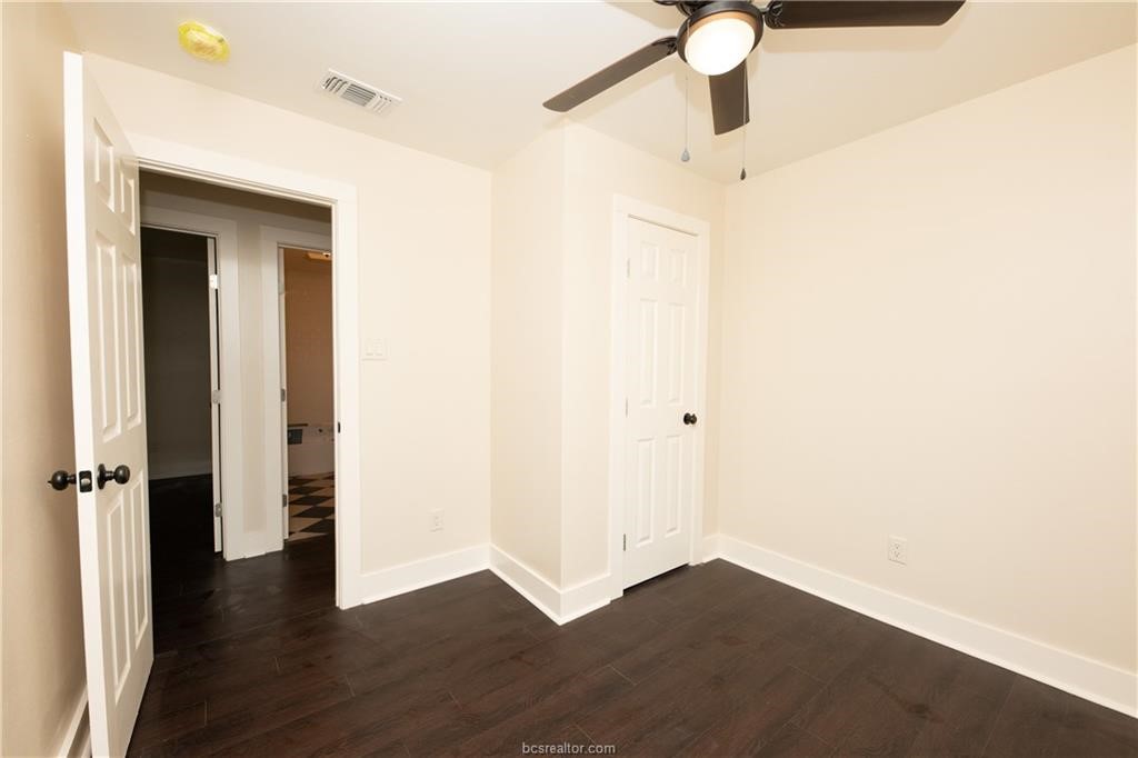 535 Husk Somerville, TX 77879 - Photo 8 of 9 a view of a hallway with wooden floor