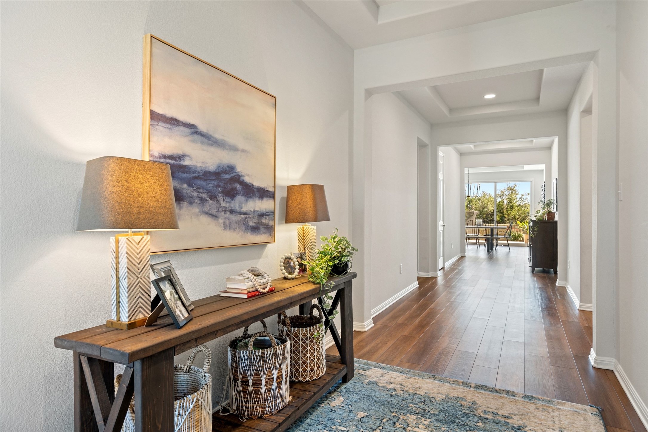 162 Lunar Loop Austin, TX 78737 - Photo 6 of 40 a view of a hallway with furniture and wooden floor