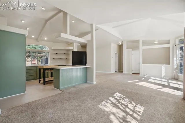 a view of a kitchen with furniture and a kitchen