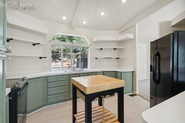 a kitchen with a table and chairs in it