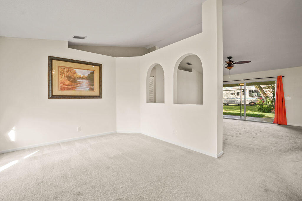 2678 Southwest Ace Road Port St. Lucie, FL 34953 - Photo 22 of 32 Formal living in to Family Room
