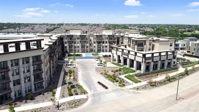 a view of a city that has lawn chairs