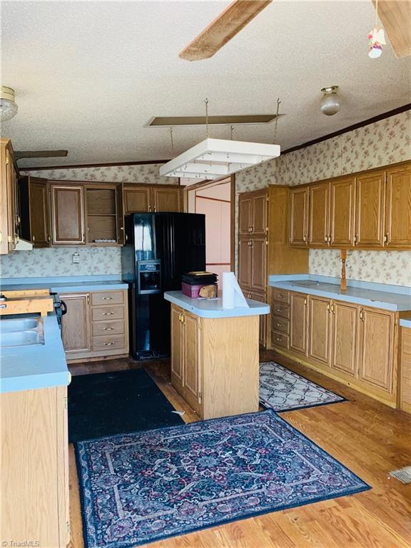 216 Price Mill Road Summerfield, NC 27358 - Photo 4 of 10 Plenty of cabinet space in the kitchen with eat-in breakfast area