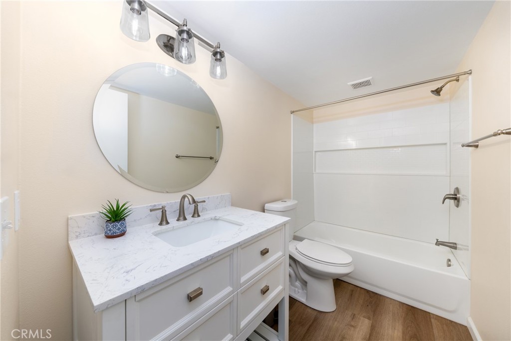 2760 Monroe Street Riverside, CA 92504 - Photo 13 of 21 a bathroom with a sink a toilet and shower