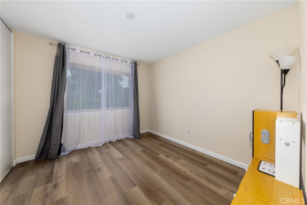 2760 Monroe Street Riverside, CA 92504 - Photo 14 of 21 a view of room with window and hardwood floor
