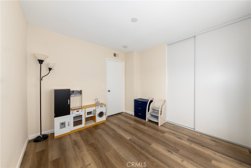 2760 Monroe Street Riverside, CA 92504 - Photo 15 of 21 a room with a bed and a flat screen tv