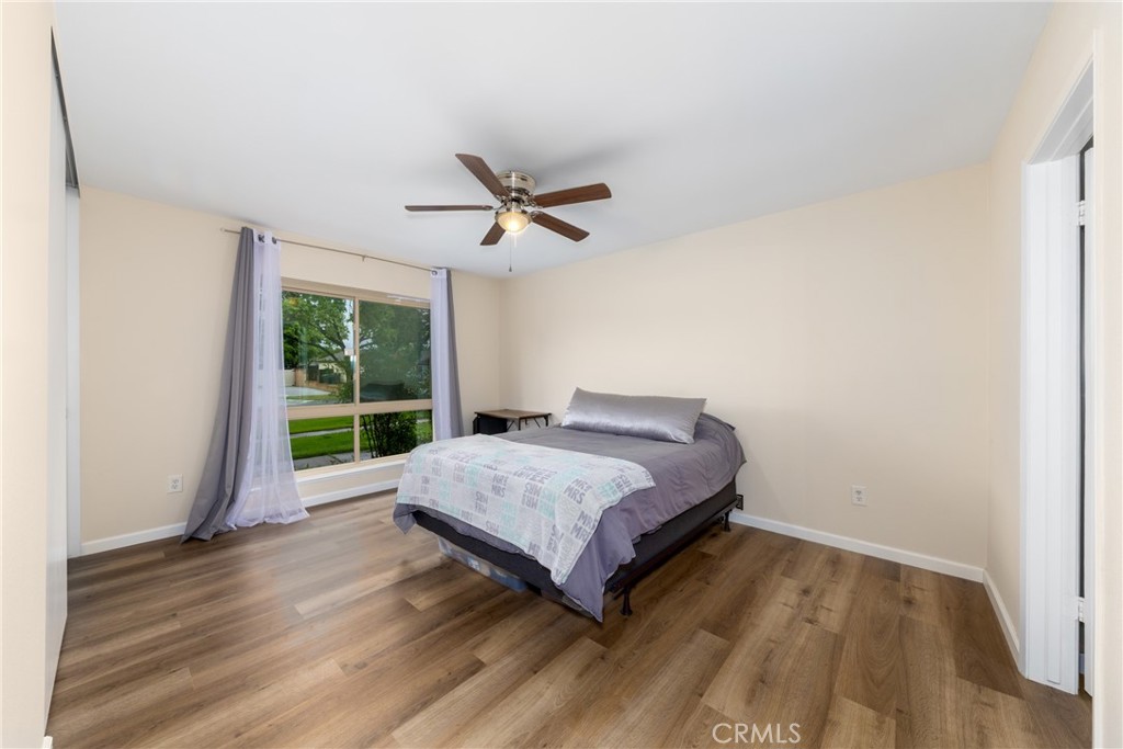 2760 Monroe Street Riverside, CA 92504 - Photo 17 of 21 a spacious bedroom with a bed and a large window