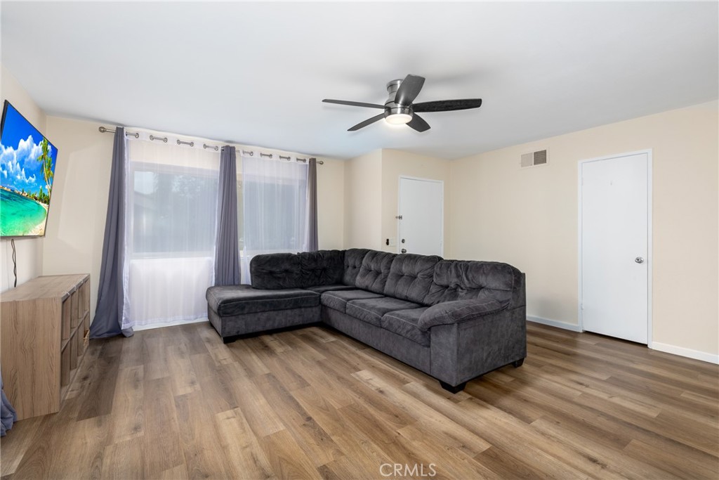 2760 Monroe Street Riverside, CA 92504 - Photo 6 of 21 a living room with furniture and a flat screen tv