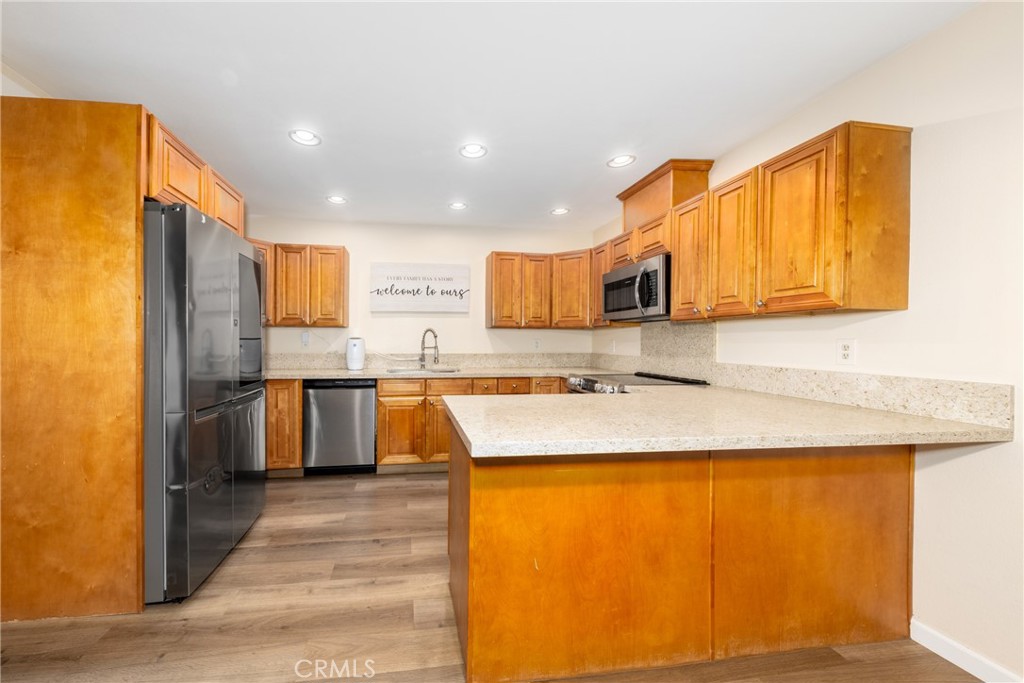 2760 Monroe Street Riverside, CA 92504 - Photo 8 of 21 a kitchen with stainless steel appliances granite countertop a sink stove and refrigerator