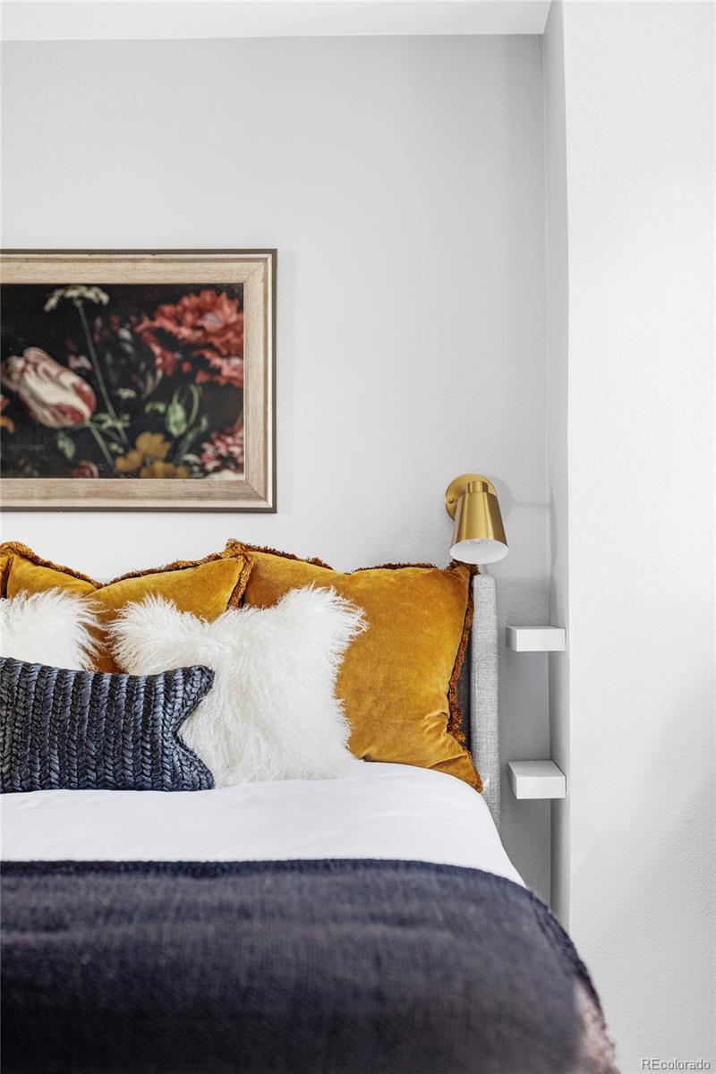 1035 East 10th Avenue, Unit 6 Denver, CO 80218 - Photo 21 of 32 a bedroom with a bed and painting on the wall