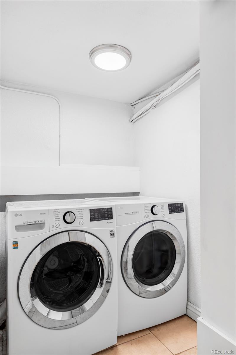 1035 East 10th Avenue, Unit 6 Denver, CO 80218 - Photo 30 of 32 a utility room with dryer and washer