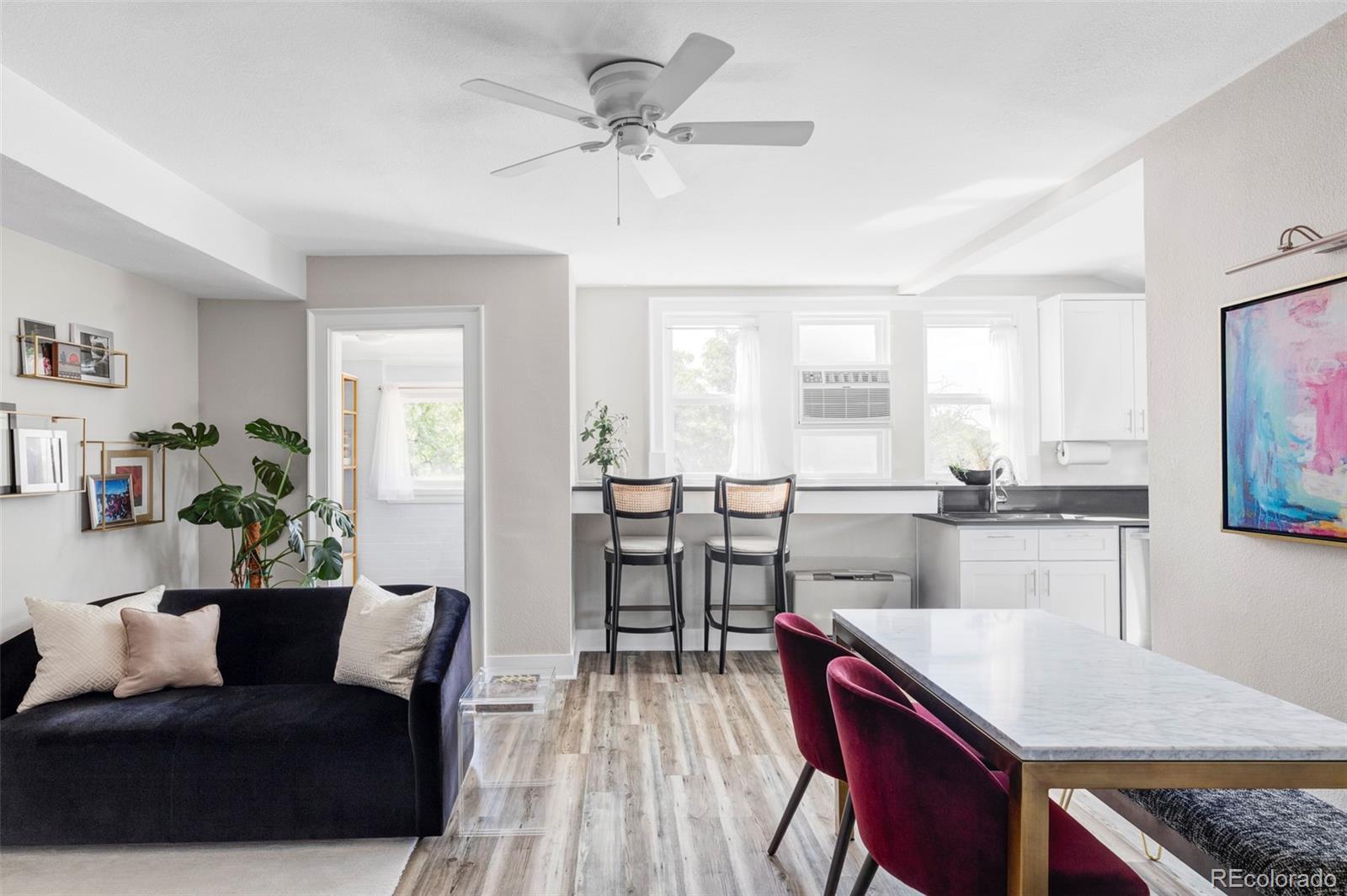 1035 East 10th Avenue, Unit 6 Denver, CO 80218 - Photo 8 of 32 a view of a dining room with furniture and a window