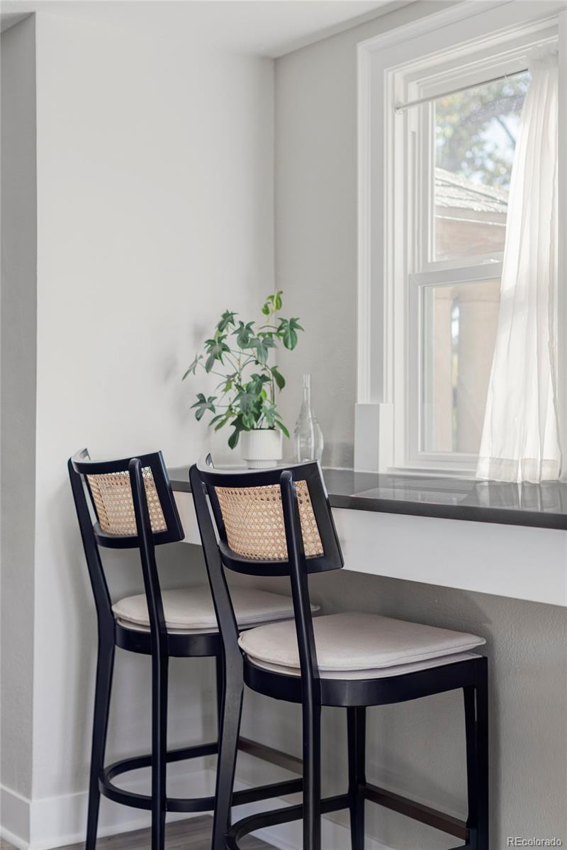 1035 East 10th Avenue, Unit 6 Denver, CO 80218 - Photo 10 of 32 a view of a dining room with furniture and window