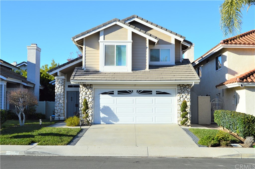 28805 Vista Aliso Road Lake Forest, CA 92679 - Photo 1 of 1 a front view of a house with a yard and garage