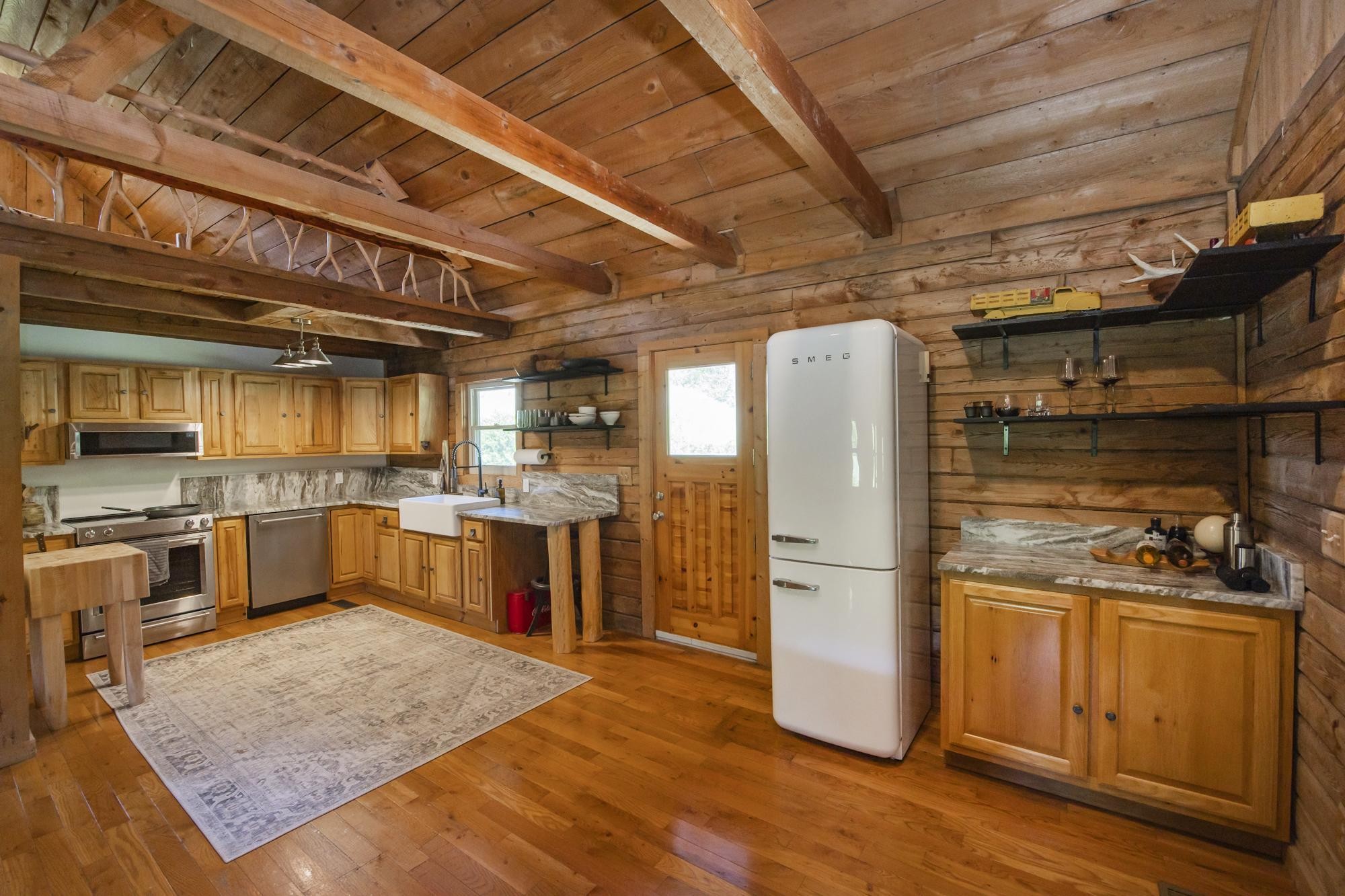 a kitchen with refrigerator and stove