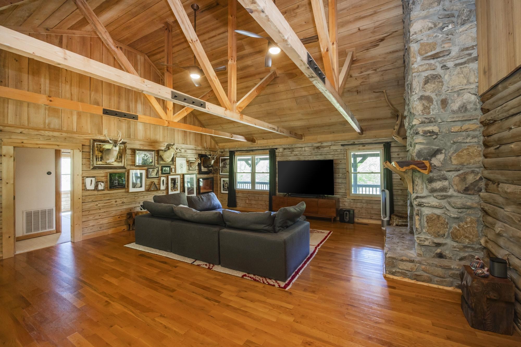 1370 Dog Branch Road Hartsville, TN 37074 - Photo 14 of 60 a living room with fireplace furniture and a wooden floor