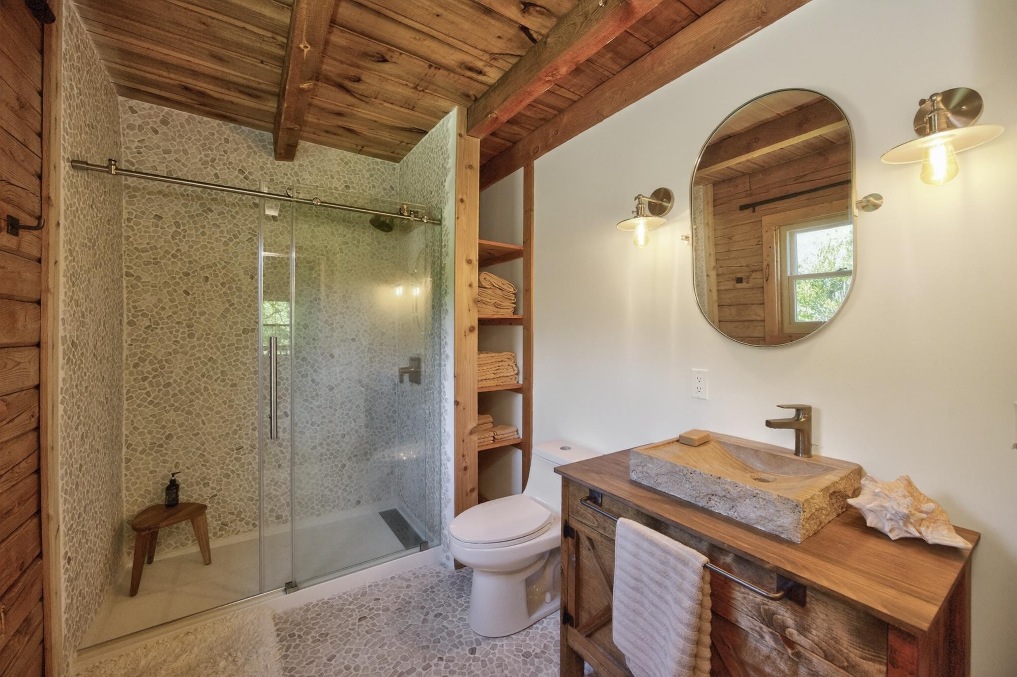 1370 Dog Branch Road Hartsville, TN 37074 - Photo 30 of 60 a bathroom with a granite countertop sink toilet a mirror and shower