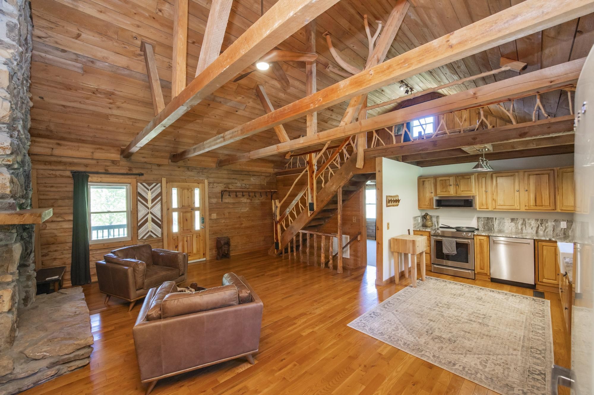 1370 Dog Branch Road Hartsville, TN 37074 - Photo 4 of 60 a living room with lots of furniture and kitchen view