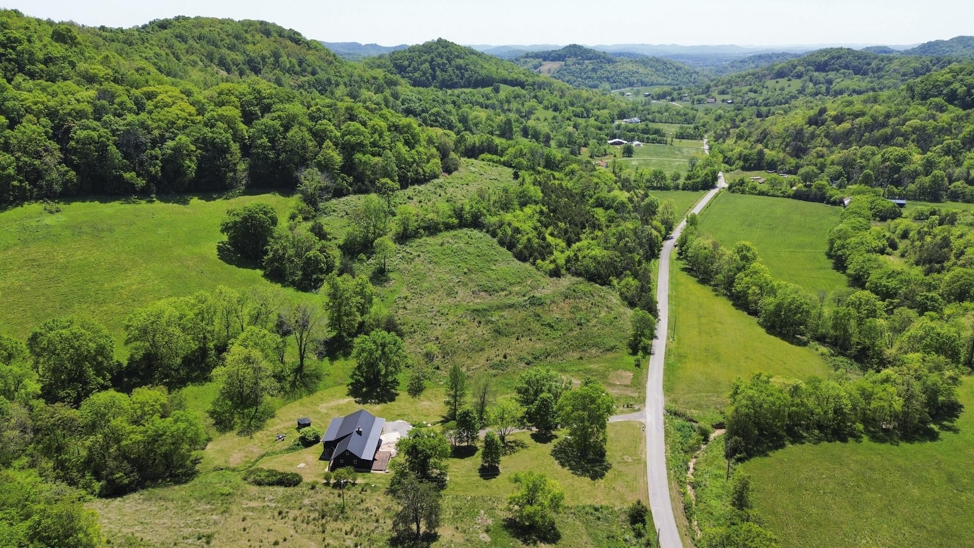 1370 Dog Branch Road Hartsville, TN 37074 - Photo 48 of 60 an aerial view of a forest with houses