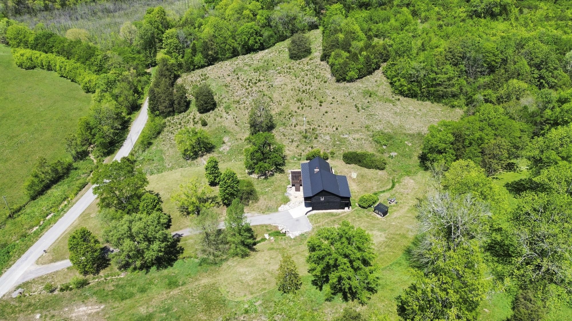 1370 Dog Branch Road Hartsville, TN 37074 - Photo 52 of 60 an aerial view of residential house with outdoor space and trees all around