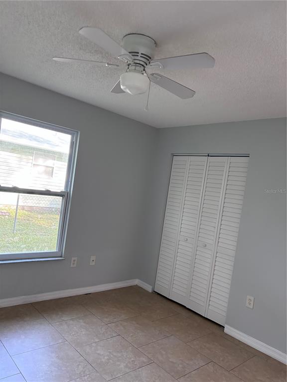 2547 24th Street Sarasota, FL 34234 - Photo 8 of 11 an empty room with a window