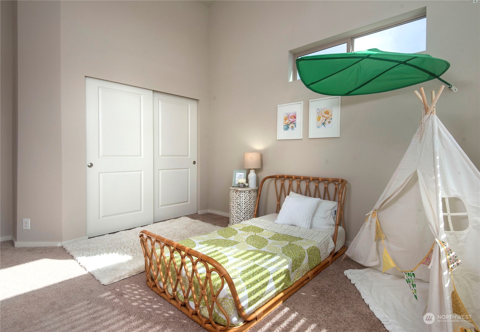 4525 Northeast 3rd Lane Renton, WA 98059 - Photo 19 of 26 a bedroom with a bed a mirror and lamp