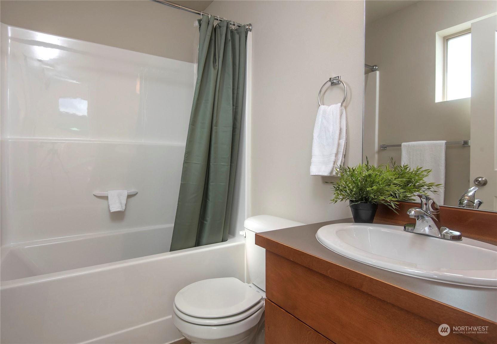 4525 Northeast 3rd Lane Renton, WA 98059 - Photo 20 of 26 a bathroom with a sink a toilet a tub and shower