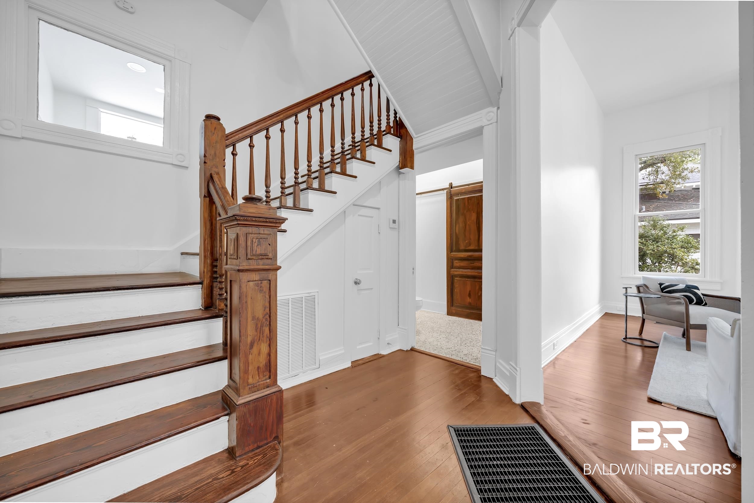 1662 Government Street Mobile, AL 36604 - Photo 9 of 33 Stairway with wood finished floors and a barn door