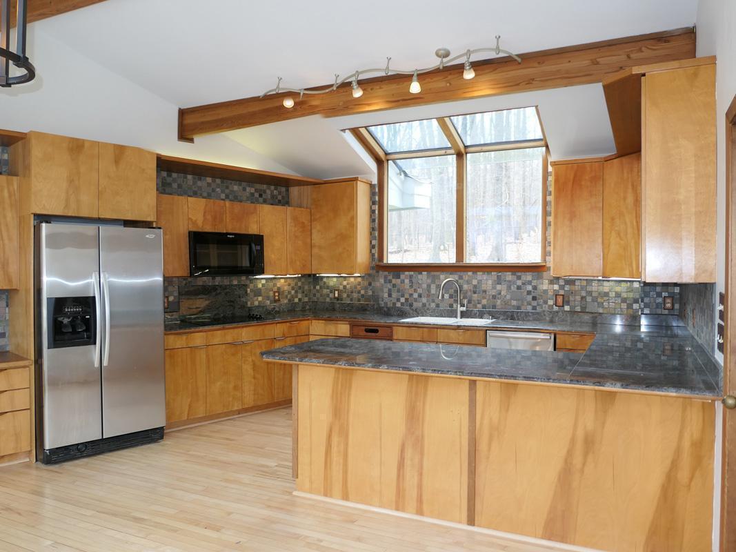 1249 Jordan Hills Loop Chapel Hill, NC 27517 - Photo 11 of 42 a kitchen with stainless steel appliances granite countertop a granite counter tops and a large window