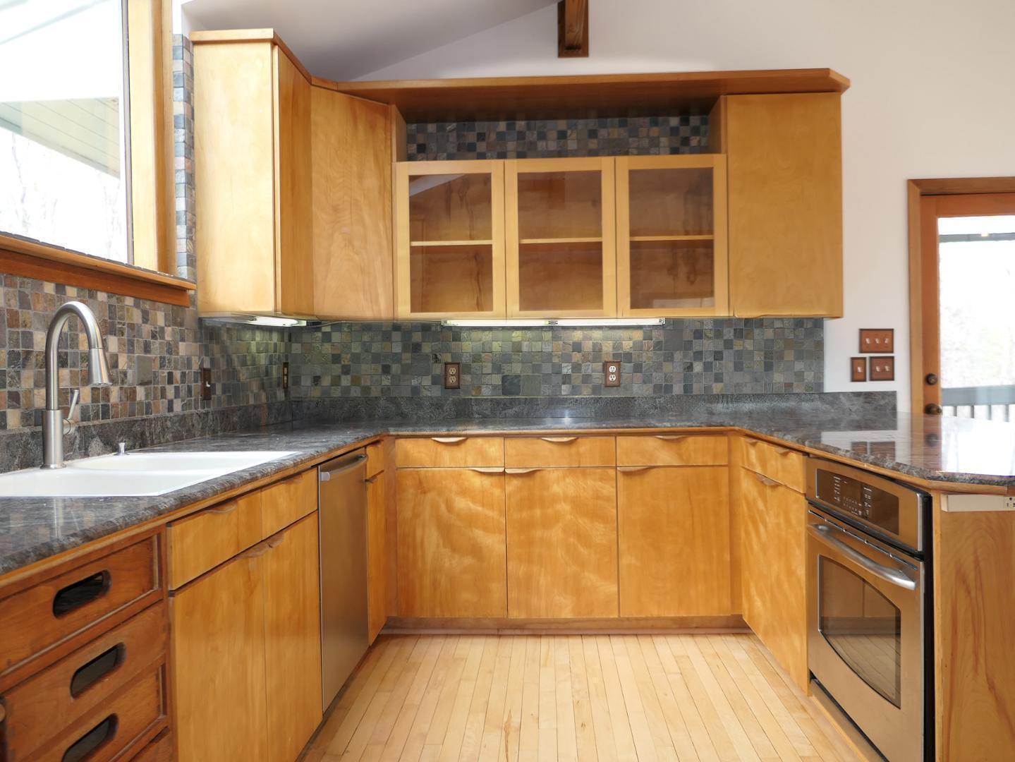 1249 Jordan Hills Loop Chapel Hill, NC 27517 - Photo 12 of 42 a view of a kitchen with granite countertop a sink and a window