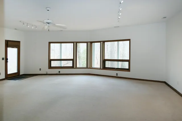 an empty room with windows and view
