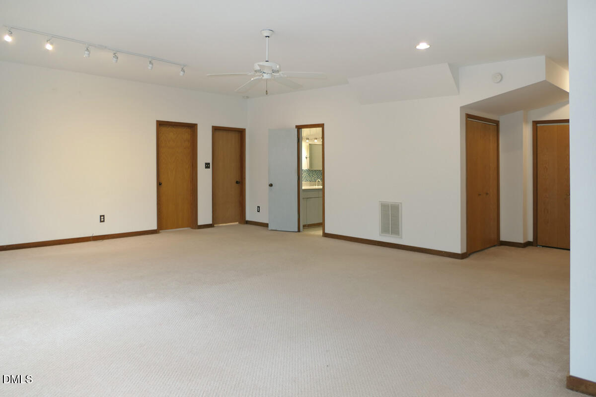 1249 Jordan Hills Loop Chapel Hill, NC 27517 - Photo 14 of 42 an empty room with closet area