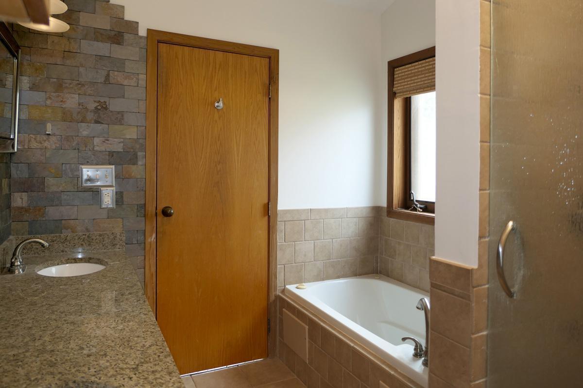 1249 Jordan Hills Loop Chapel Hill, NC 27517 - Photo 20 of 42 a bathroom with a tub shower and sink