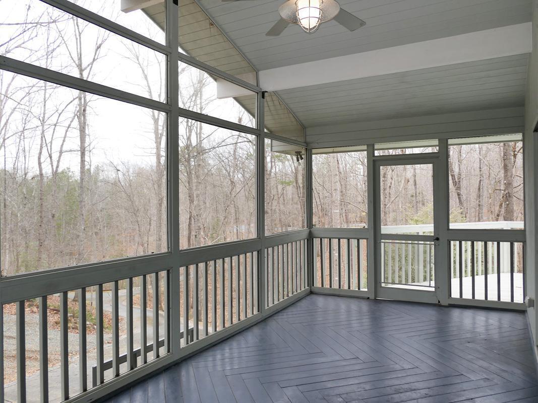 1249 Jordan Hills Loop Chapel Hill, NC 27517 - Photo 27 of 42 a view of big room with wooden floor and windows