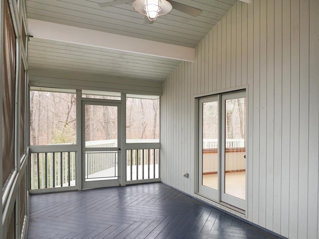 1249 Jordan Hills Loop Chapel Hill, NC 27517 - Photo 28 of 42 a view of an empty room with wooden floor and a window