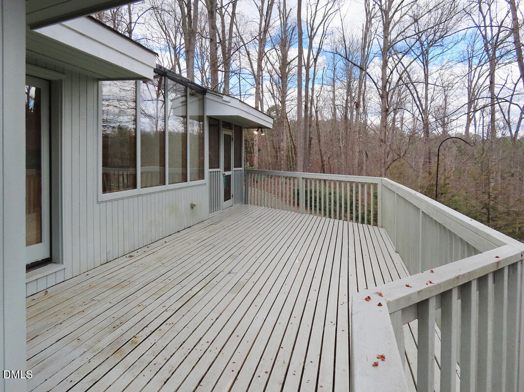 1249 Jordan Hills Loop Chapel Hill, NC 27517 - Photo 30 of 42 a view of backyard with deck and wooden floor