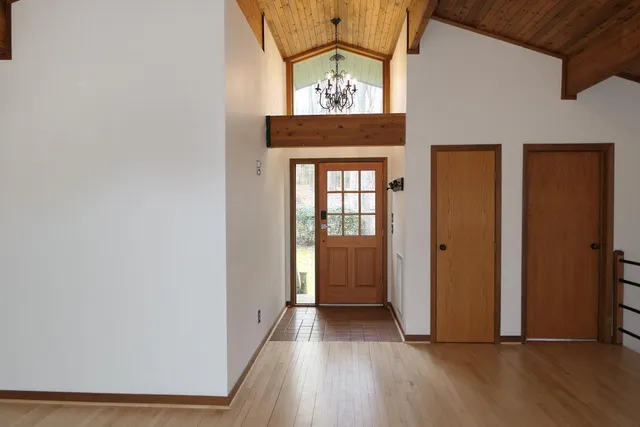 a view of an entryway with wooden floor