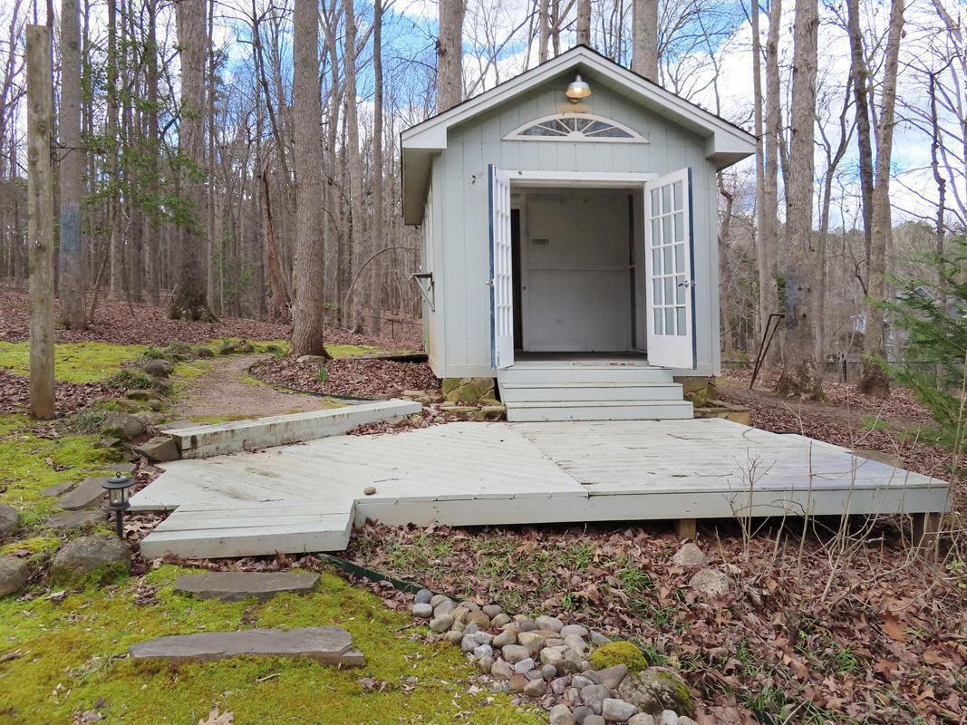 1249 Jordan Hills Loop Chapel Hill, NC 27517 - Photo 37 of 42 a view of a house with a yard and large tree