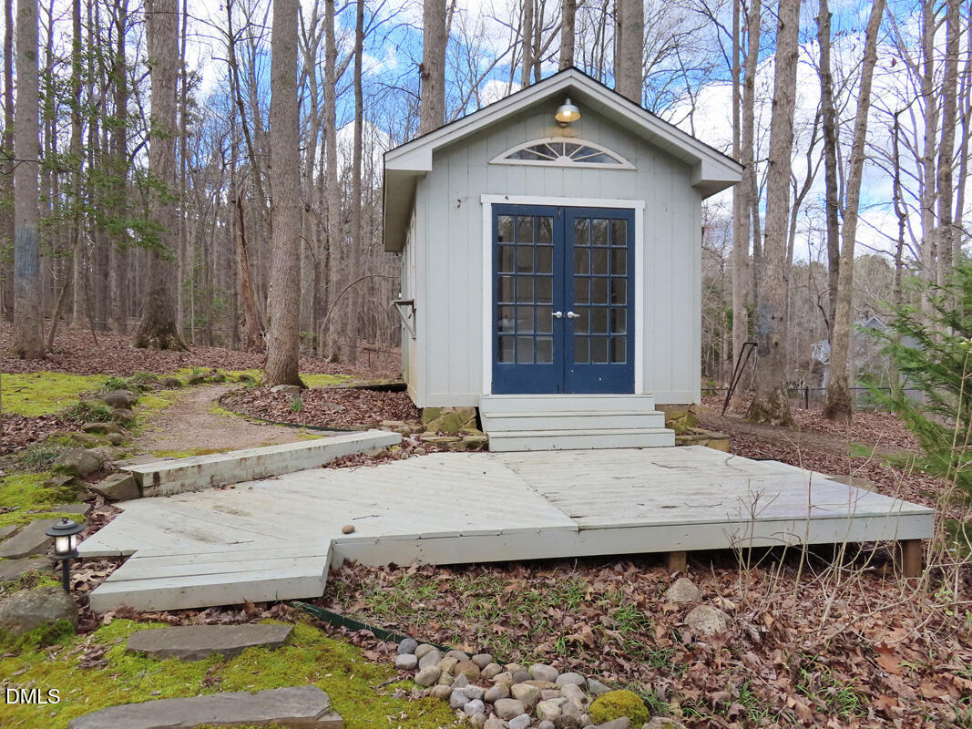 1249 Jordan Hills Loop Chapel Hill, NC 27517 - Photo 38 of 42 a view of a house with a yard and large tree