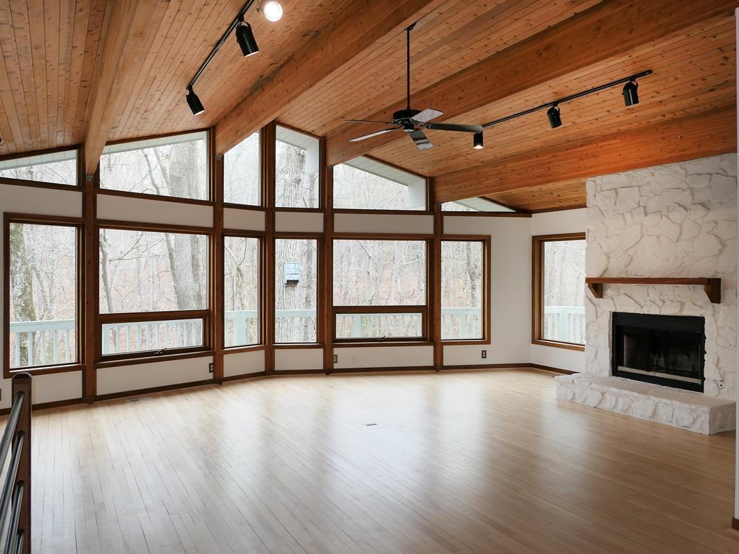 1249 Jordan Hills Loop Chapel Hill, NC 27517 - Photo 4 of 42 a view of empty room with wooden floor and fireplace