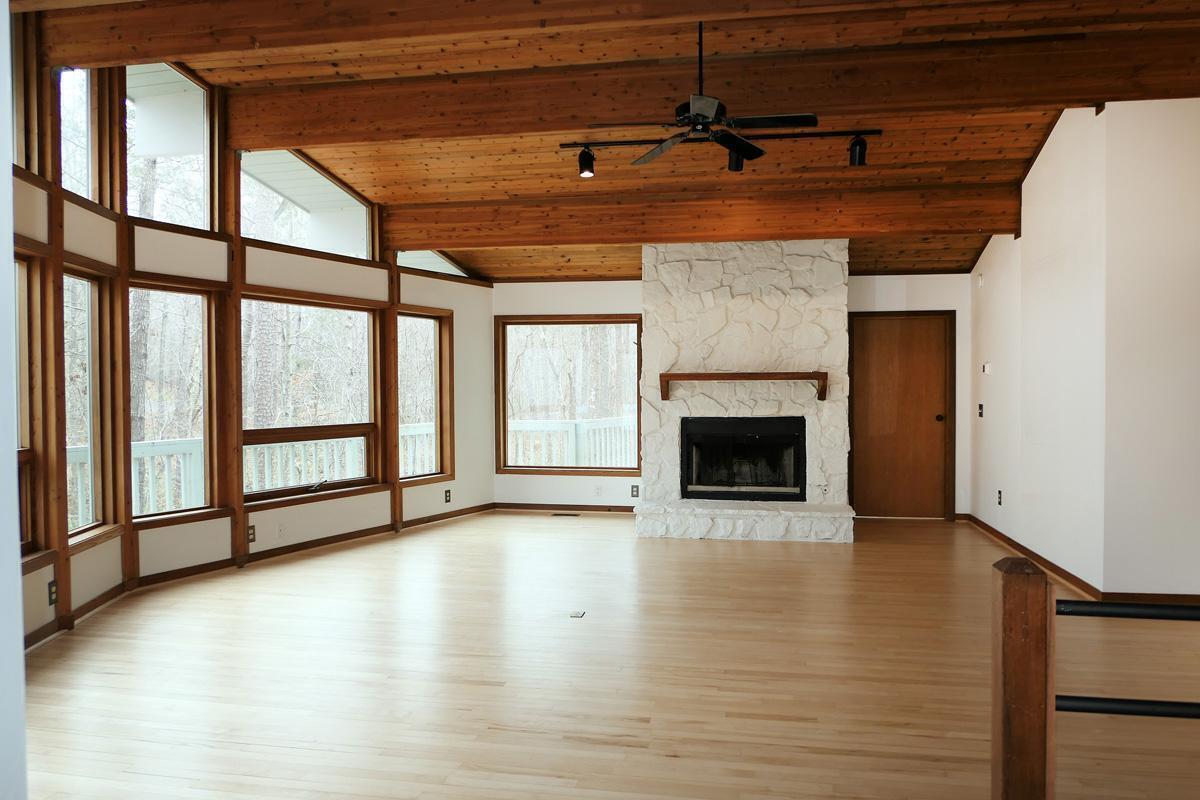 1249 Jordan Hills Loop Chapel Hill, NC 27517 - Photo 5 of 42 a view of an empty room with a fireplace and a window