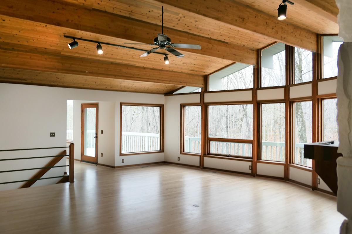 1249 Jordan Hills Loop Chapel Hill, NC 27517 - Photo 6 of 42 a view of an empty room with window and hardwood floor