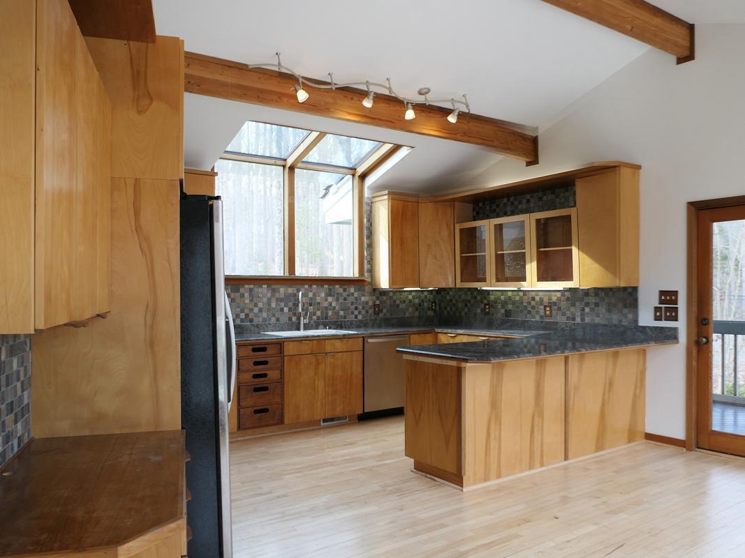 1249 Jordan Hills Loop Chapel Hill, NC 27517 - Photo 10 of 42 a kitchen with stainless steel appliances granite countertop a stove and a sink