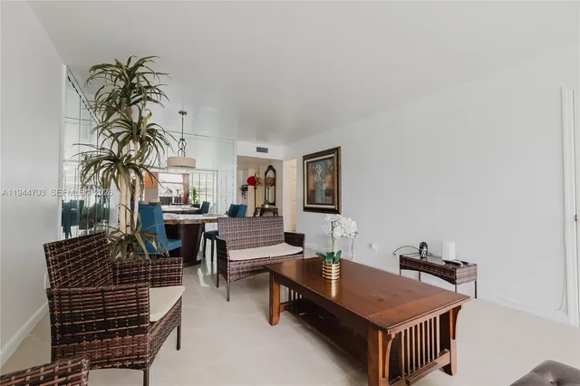 a room with furniture and a potted plant