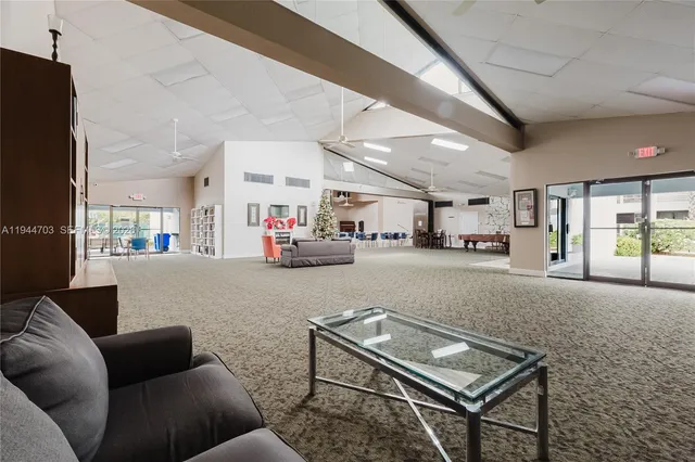a living room with furniture a table and chairs