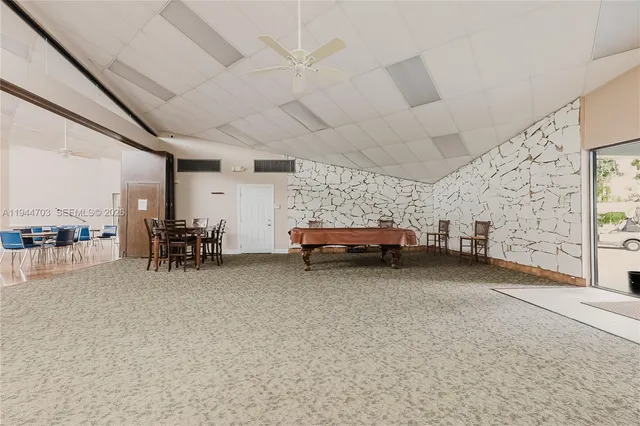 a view of a livingroom with furniture and a garage
