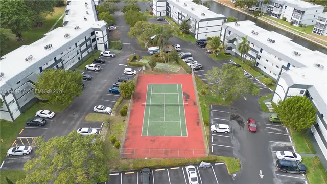 an aerial view of multiple houses with yard