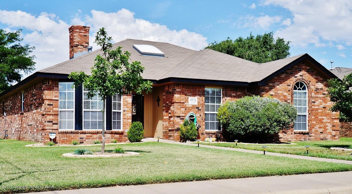 8012 Claret Street Amarillo, TX 79110 - Photo 2 of 25 a front view of a house with garden